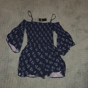 Navy blue romper with floral detail